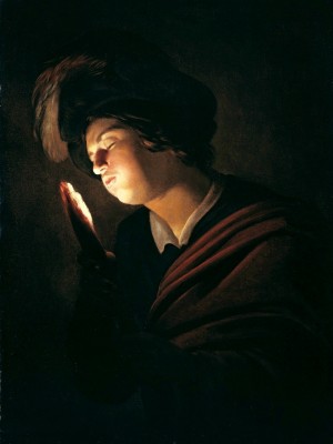 Boy blowing on an ember